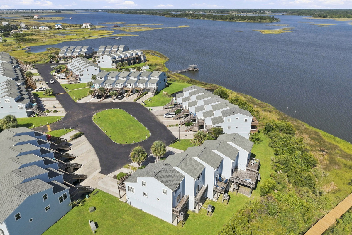 Take in the expansive coastal waters and beautifully manicured neighborhood layout from a birds-eye vantage point.