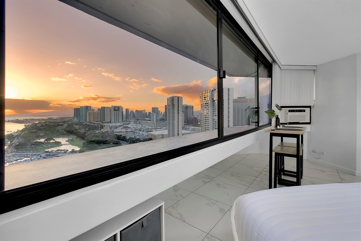 Bask in the glow of a Waikīkī sunset from the comfort of your private suite. With sweeping views of the city skyline, marina, and ocean, this tranquil space captures the magic of island evenings — the perfect way to end your day in paradise.