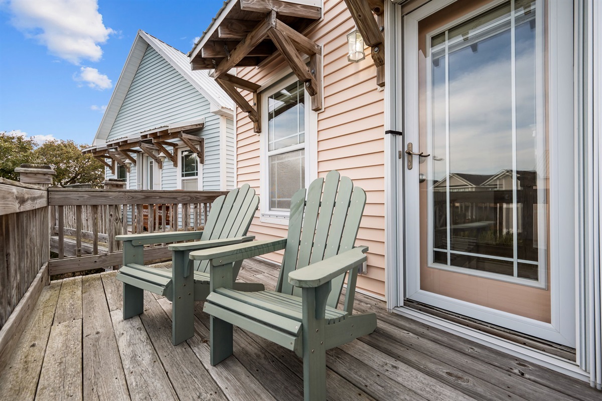 A quiet place to sit (or sip!) and relax on this private balcony just off of the top floor bedroom