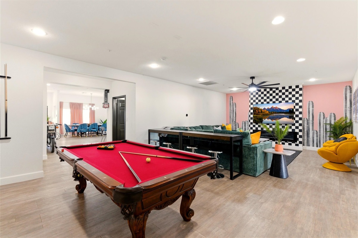 One of the largest & most plush sofas in Scottsdale! Behind the photo is a 4 stool high top table and Connect 4!  To the left is the kitchen and to the right is the game room!