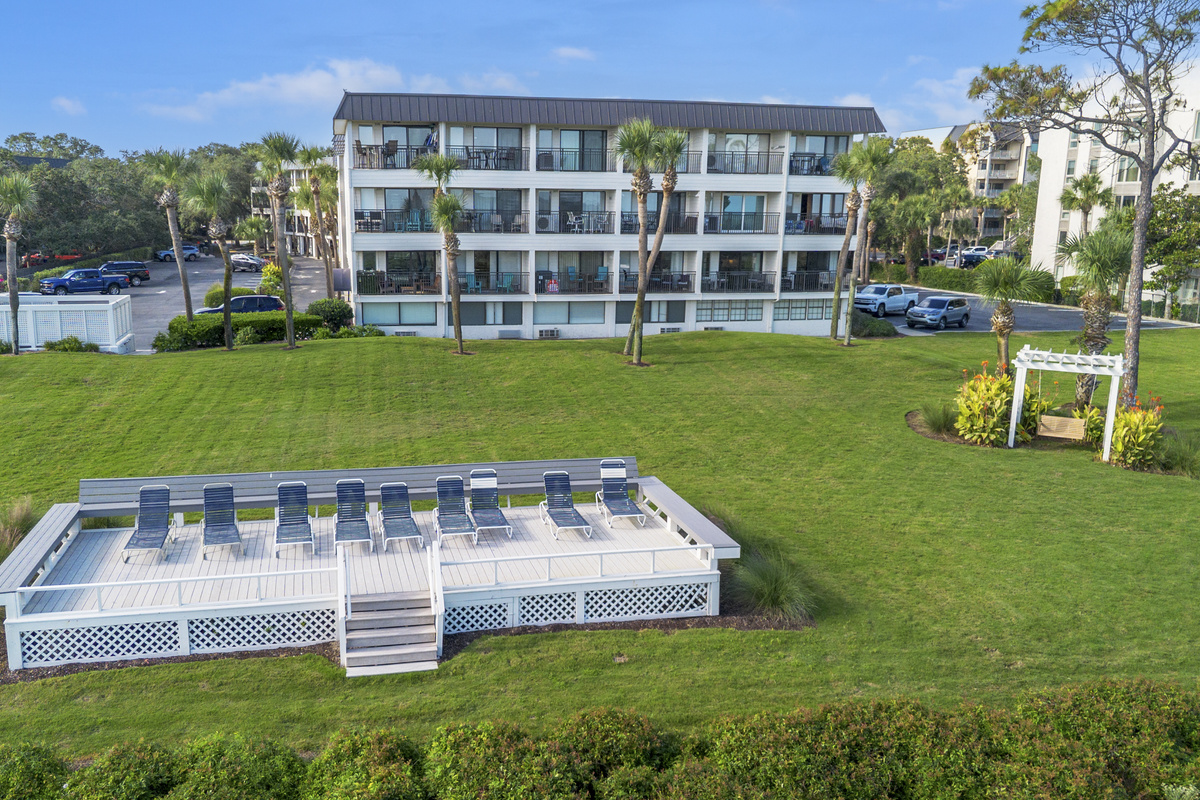 Aerial view of the beachfront sun deck, dunes, and our oceanfront building.