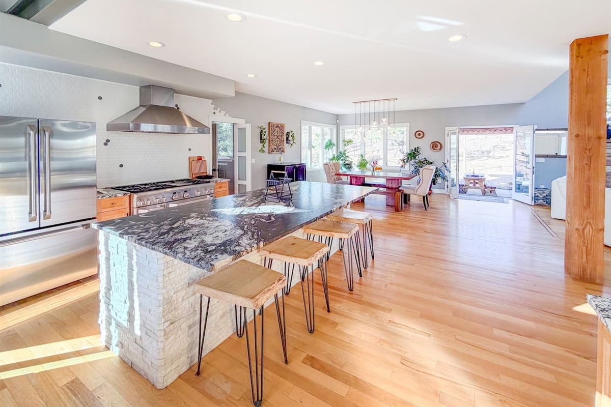 Spacious and inviting, this open kitchen and dining area is perfect for gatherings, whether cooking together or enjoying meals with family and friends