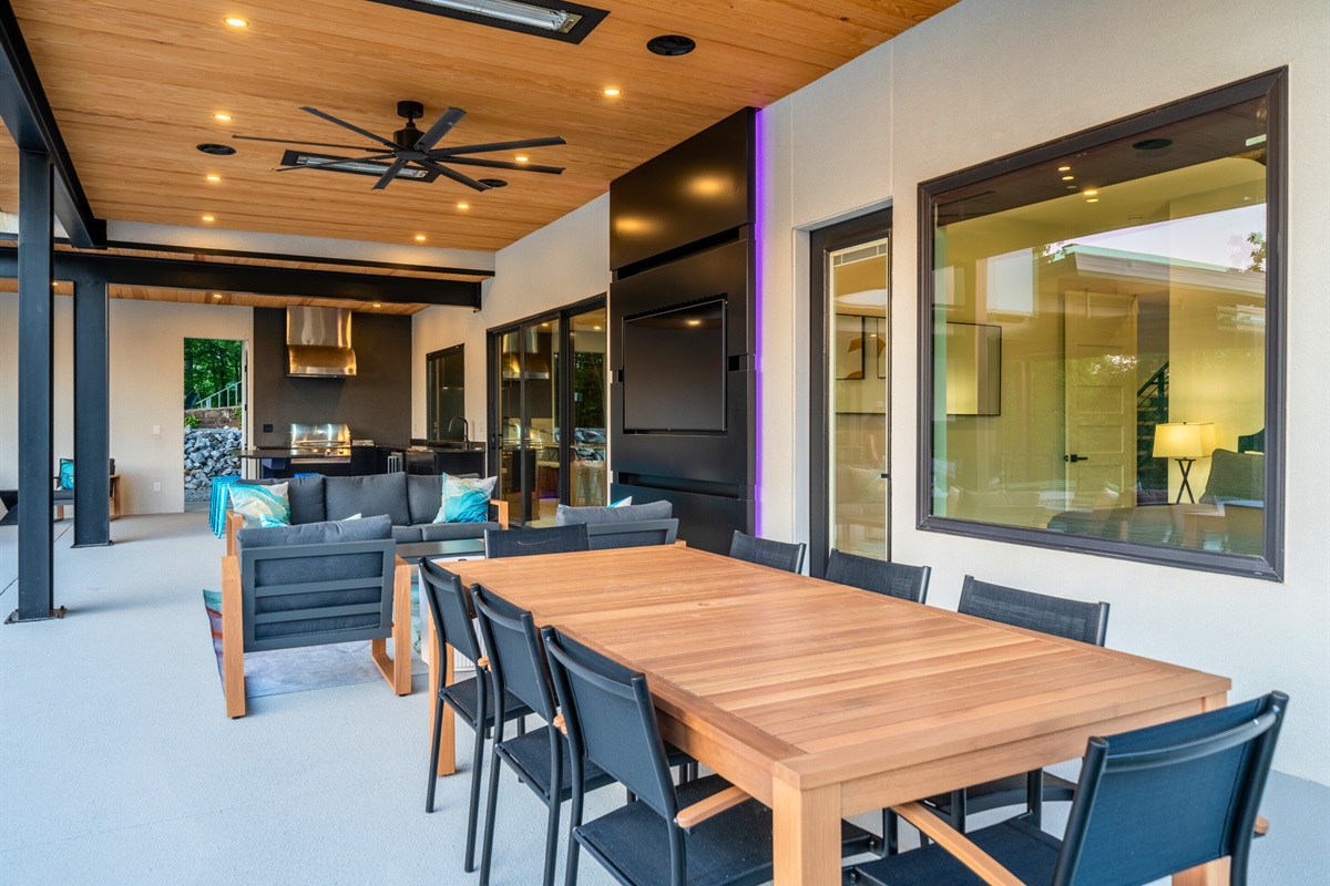 Dine al fresco in this beautifully designed outdoor dining area, perfect for gatherings and family meals.