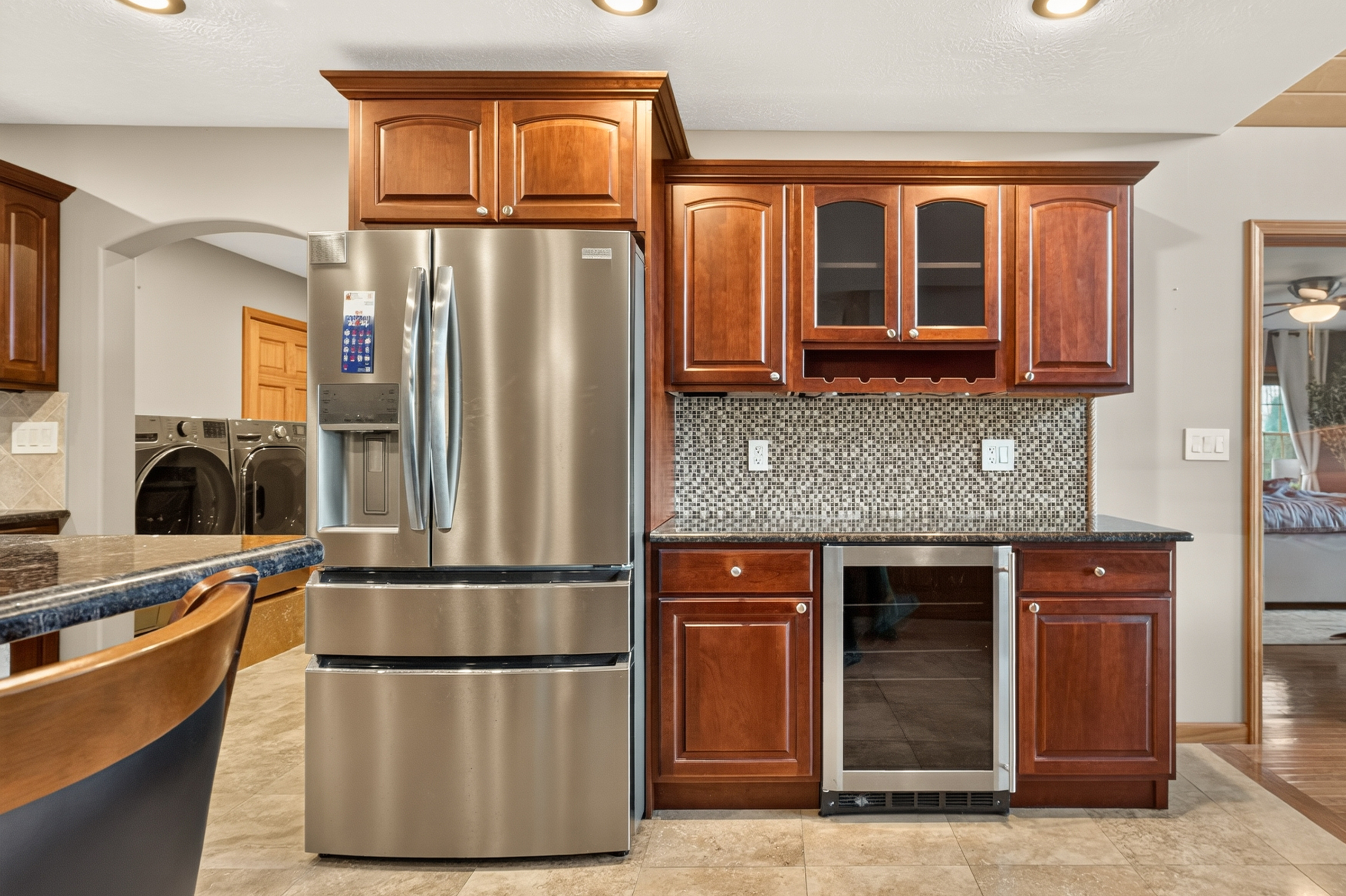 Kitchen cabinetry with built-in beverage refrigerator
