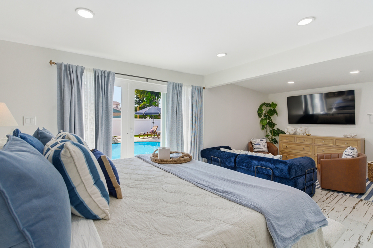 Bedroom #1 is large and features a King bed and a Queen pullout couch.