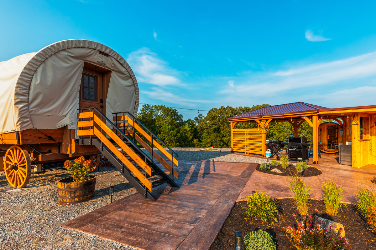 Private walkway connecting the wagon, landscaped patio, spa pavilion, and outdoor living spaces.