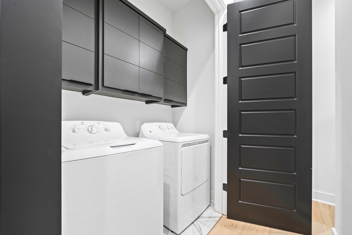 The laundry area offers modern appliances and plenty of space, ensuring your stay is as convenient and comfortable as possible.