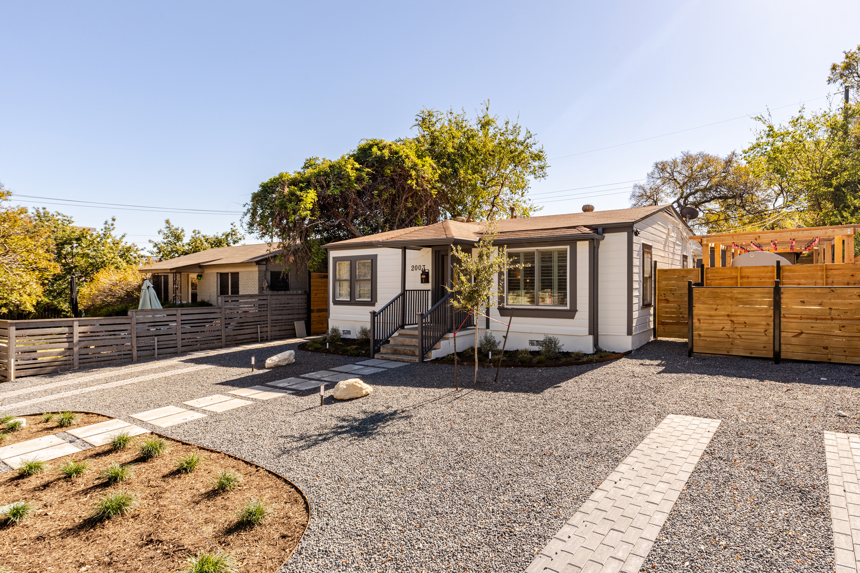 Enjoy the spacious yard and polished pathway in this stylish Austin retreat!