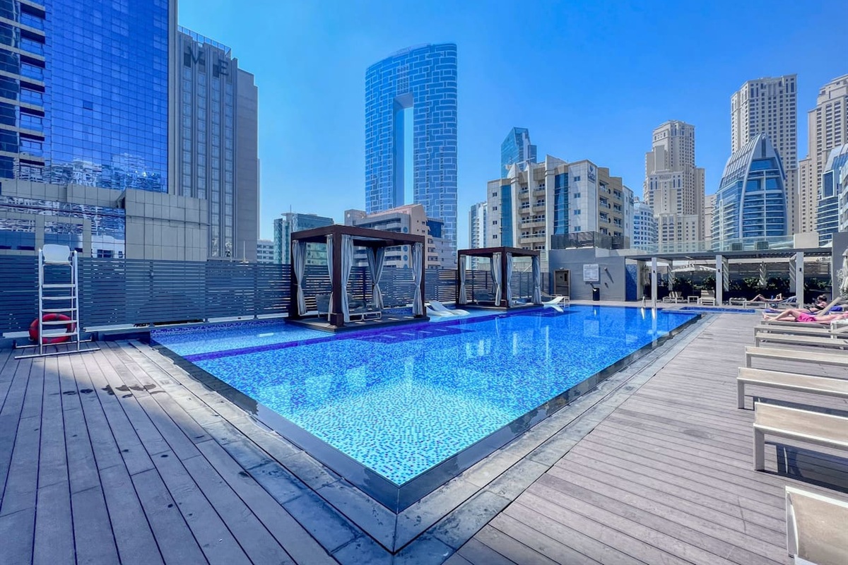 Stunning swimming pool with temperature controlled water, Jacuzzi, sunbeds and cabanas free for guests