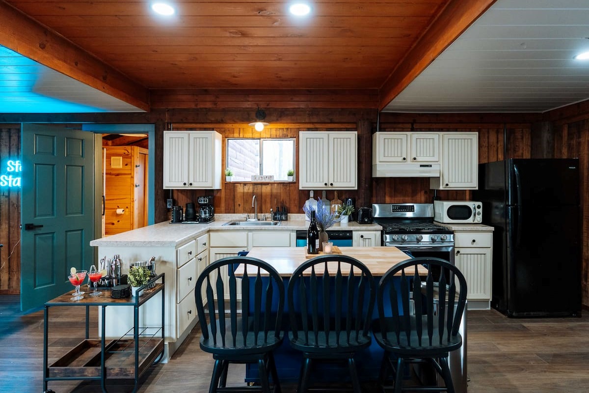 A chef-ready space featuring a dishwasher and all the tools for an effortless forest feast