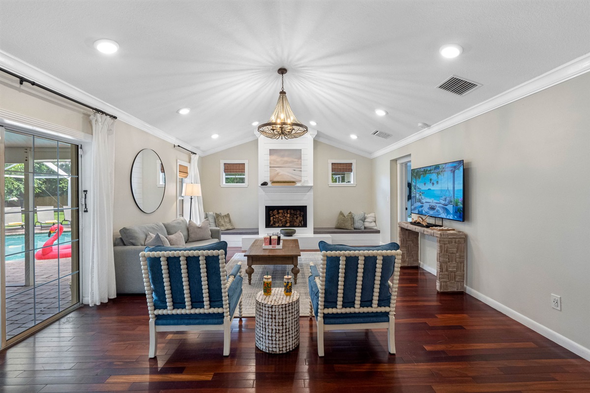 With natural light streaming in through large windows, this living room blends comfort and style seamlessly.