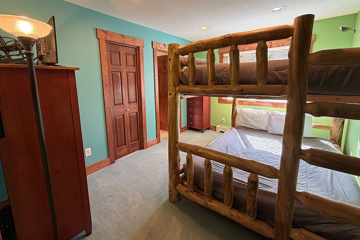 Bedroom #2 with Queen-over-Queen bunk beds and attached full bathroom on upper level.