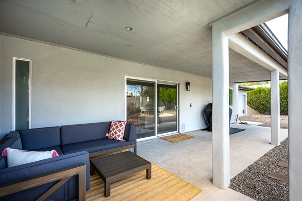 Relaxing patio makes a great place to watch the kids swim or chat with the grillmaster.