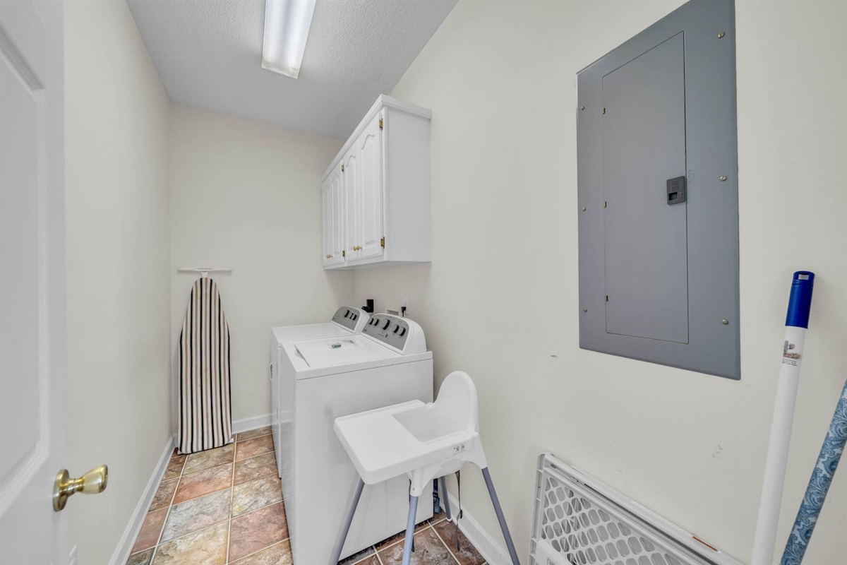 Washer and dryer, ironing board, high chair, baby gate