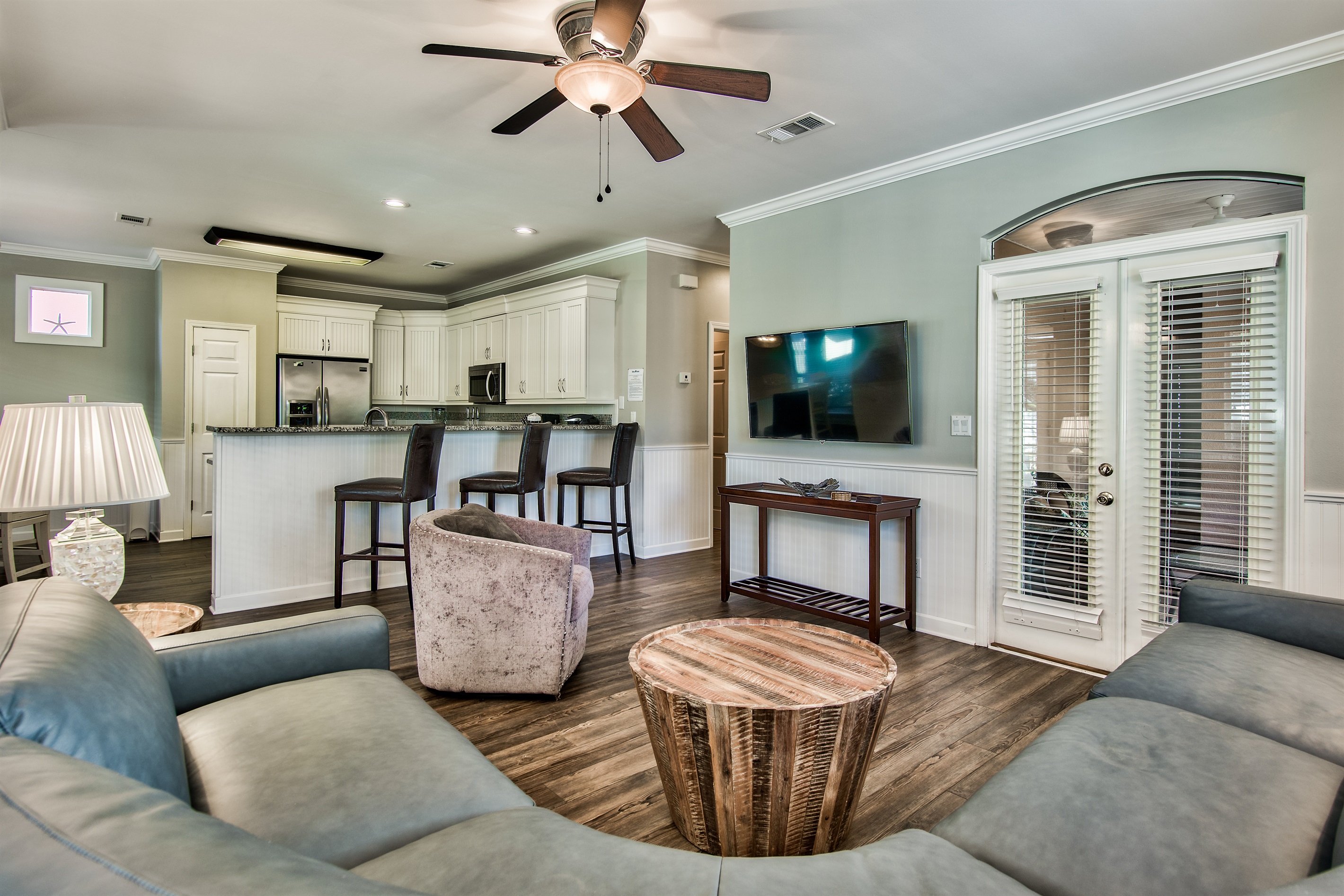 Spacious living room with direct access to the screened porch