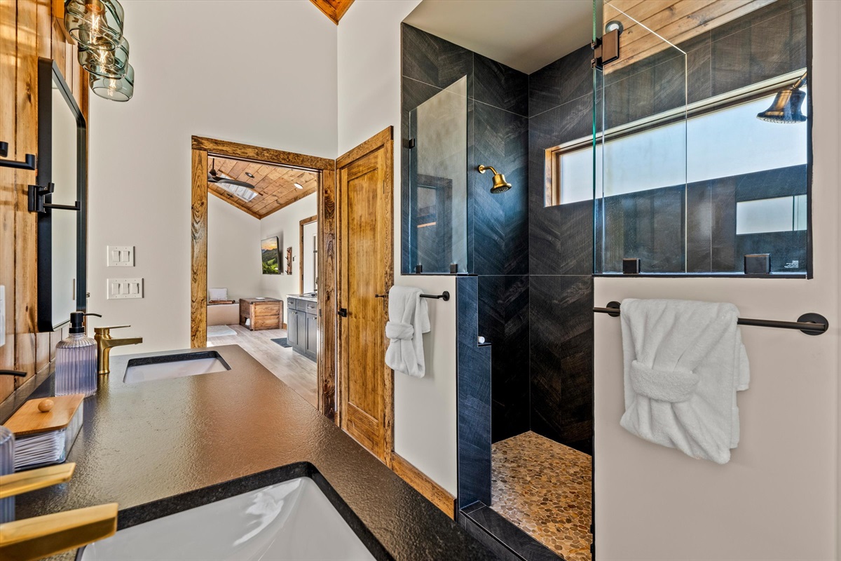 Two-person walk in shower with glass door