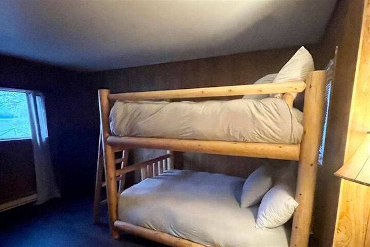Bunk room with comfortable bedding and practical layout