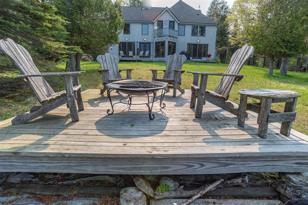 A great gathering spot at the lake's edge. Hand made Adirondack chairs. Enjoy the firebowl at night or side table for your morning coffee!