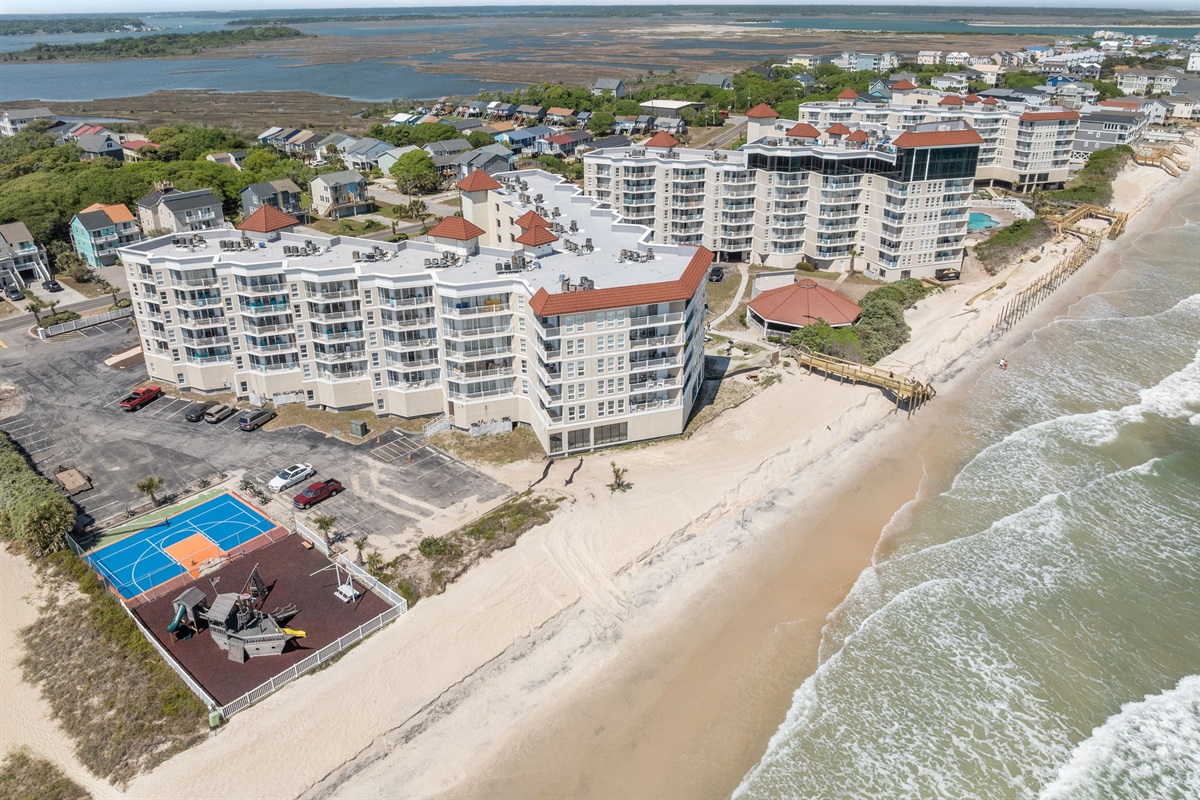 True beachfront living with private beach access and on-site amenities