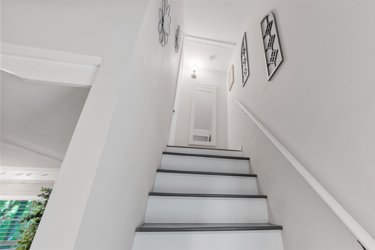 Stairs leading the secondary bedroom