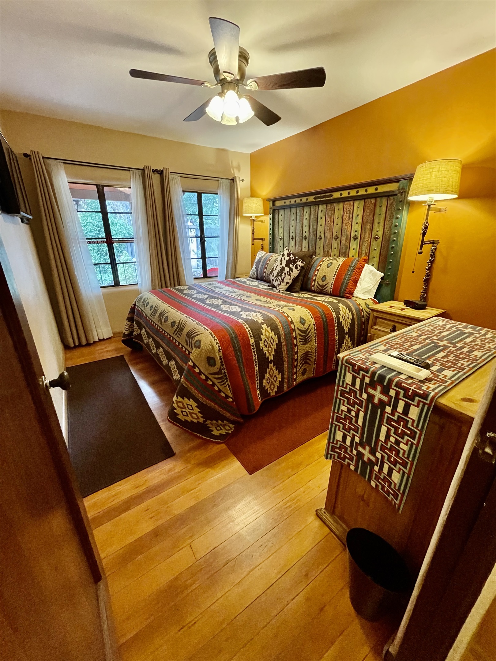 Wake up to garden views in this cozy king bed with southwestern charm.