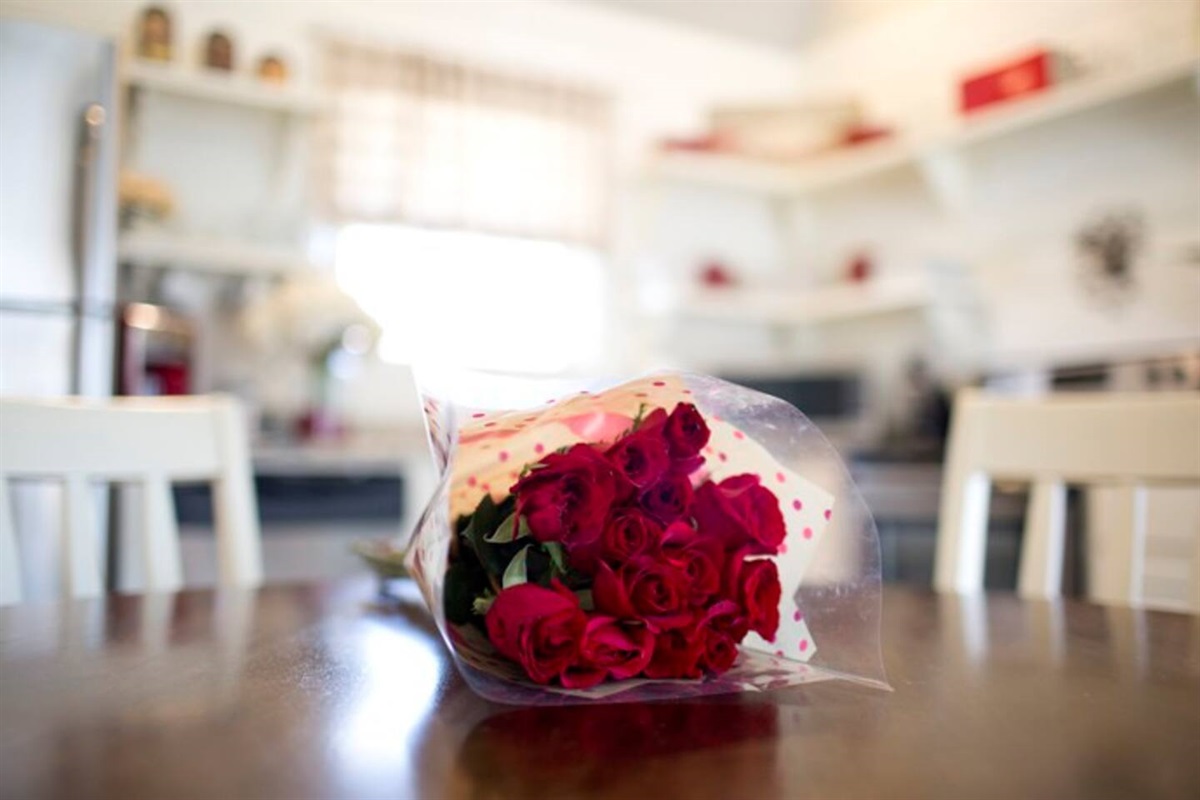 Roses in Farmhouse Kitchen of Cottage Rental in Arkansas