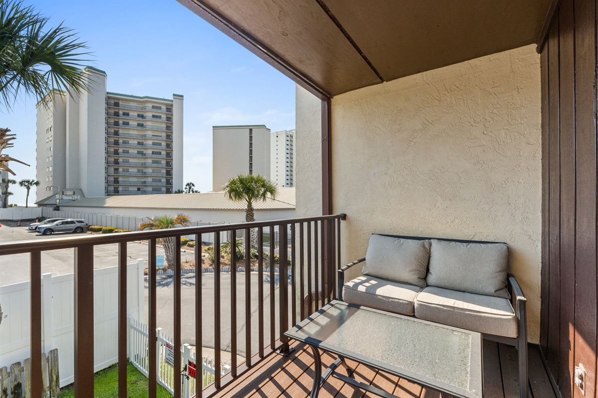 Balcony off of Bedroom 1 with outdoor seating