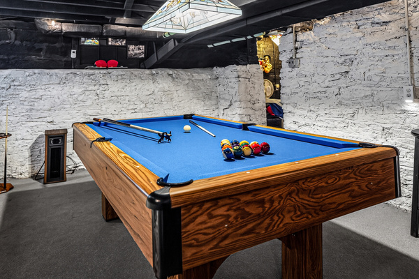 Enjoy a fun game of pool because winning isn't everything...right! There is a fan and a heater, a table and two chairs, and a stool in here too. Party lights!
