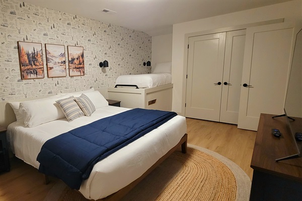 Lower level bedroom with king and twin bed with memory foam mattresses.