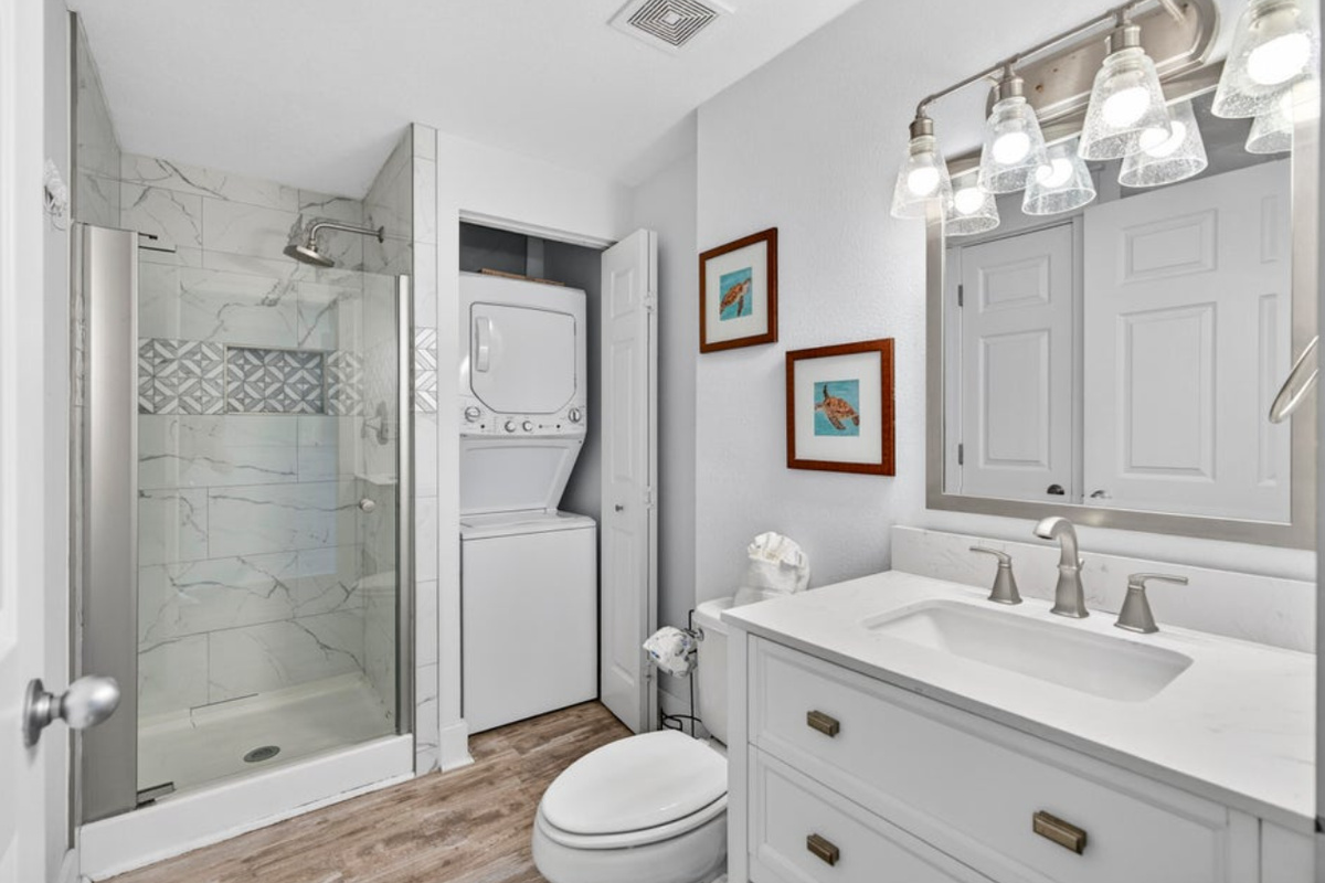 Majestic Sun A1008's second bathroom is also fully remodeled with a walk in shower, new vanity, and washer/dryer with plenty of laundry supplies!