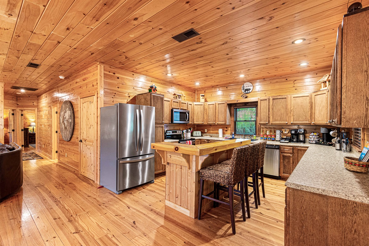 Kitchen Delight: Cook up a feast in this stunning wood-accented kitchen with modern amenities!