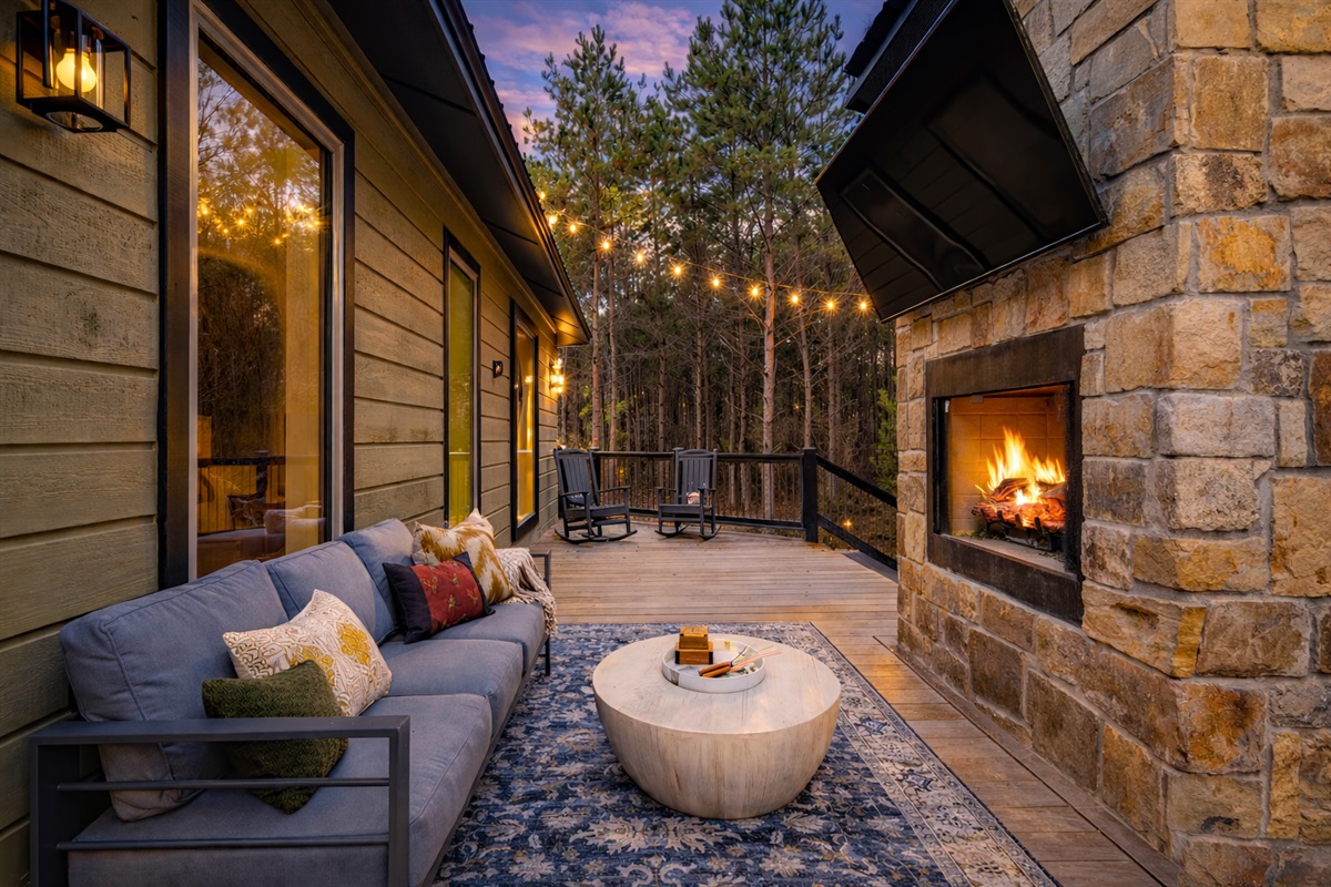 Enjoy a second fireplace and hang out area with television on the patio. 