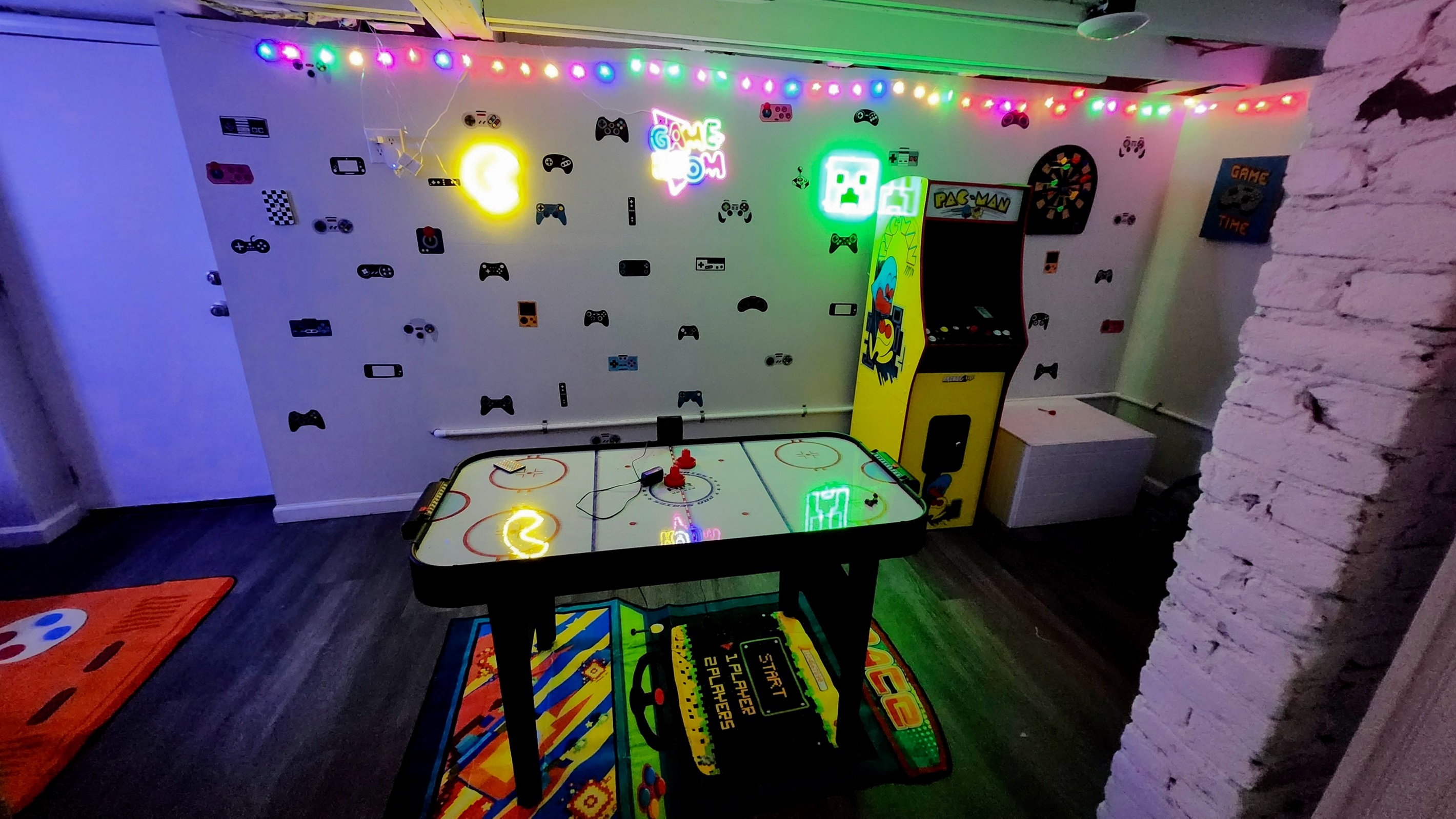 The game room is the place to be at Magic City Manor. We have it stacked with all the games you could dream! Even a life-size connect four game, a gaming desk, air hockey, darts, and a working pacman machine!