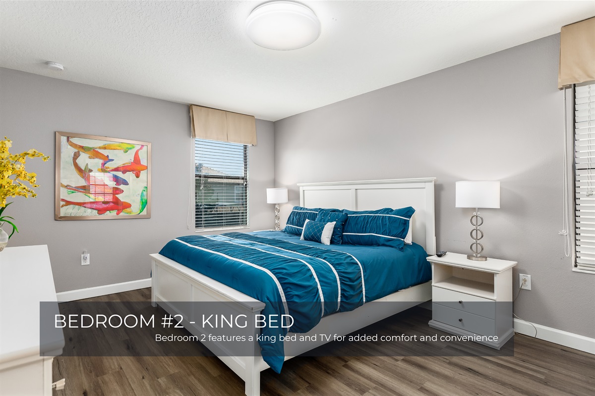 Bedroom 2 offers a spacious king bed and a TV for relaxing nights in