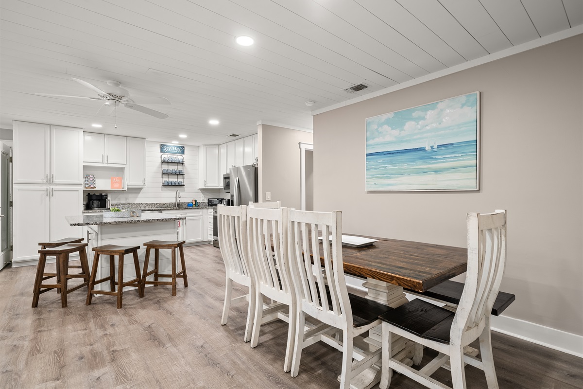 One of three of the home's dining areas; this furniture with a bench will seat many guests comfortably!