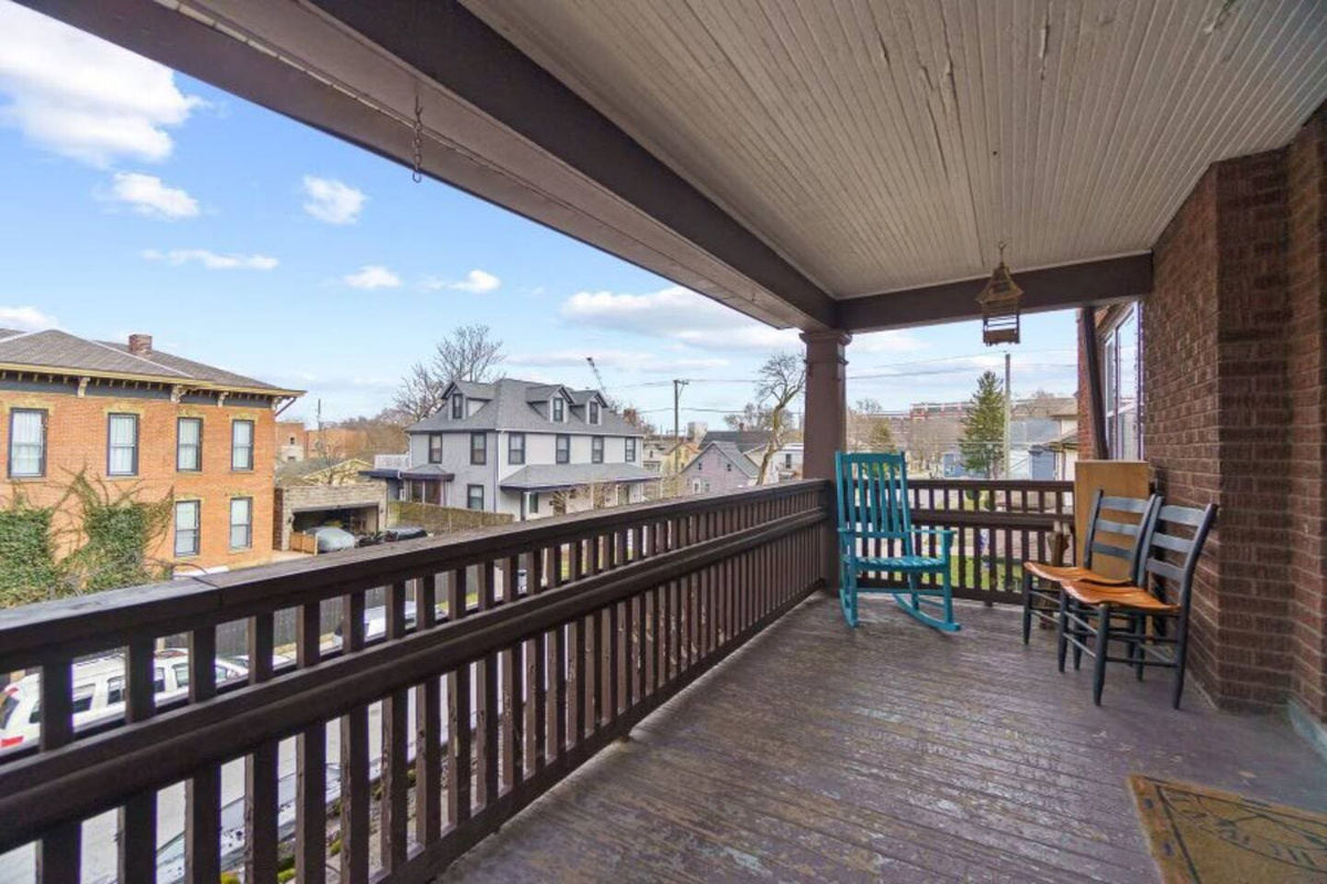 Charming balcony with comfortable sitting furniture, perfect for relaxing and enjoying the view.