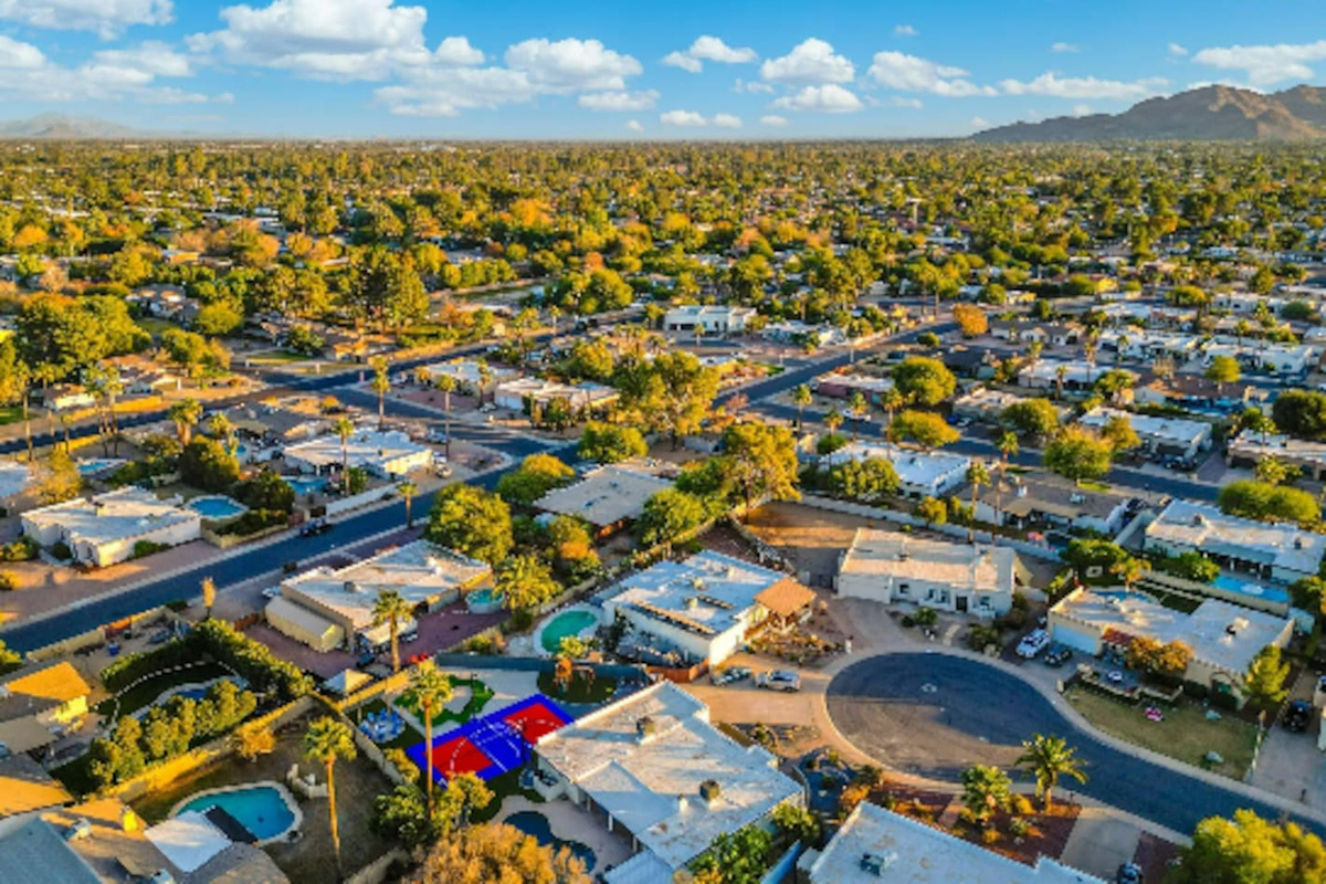 Set in a quiet, established Scottsdale neighborhood, with the property's own color-block court giving it away from the sky.