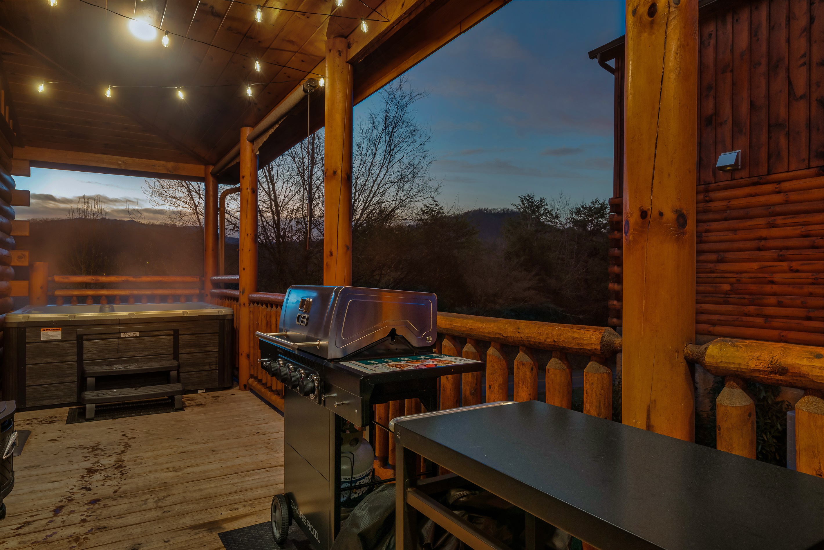 Patio Bliss: Unwind under twinkling lights with stunning mountain views and a sizzling grill!