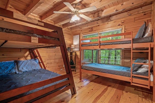 Bedroom with bunk beds on main floor has a twin over twin bunk and a twin over full bunk.