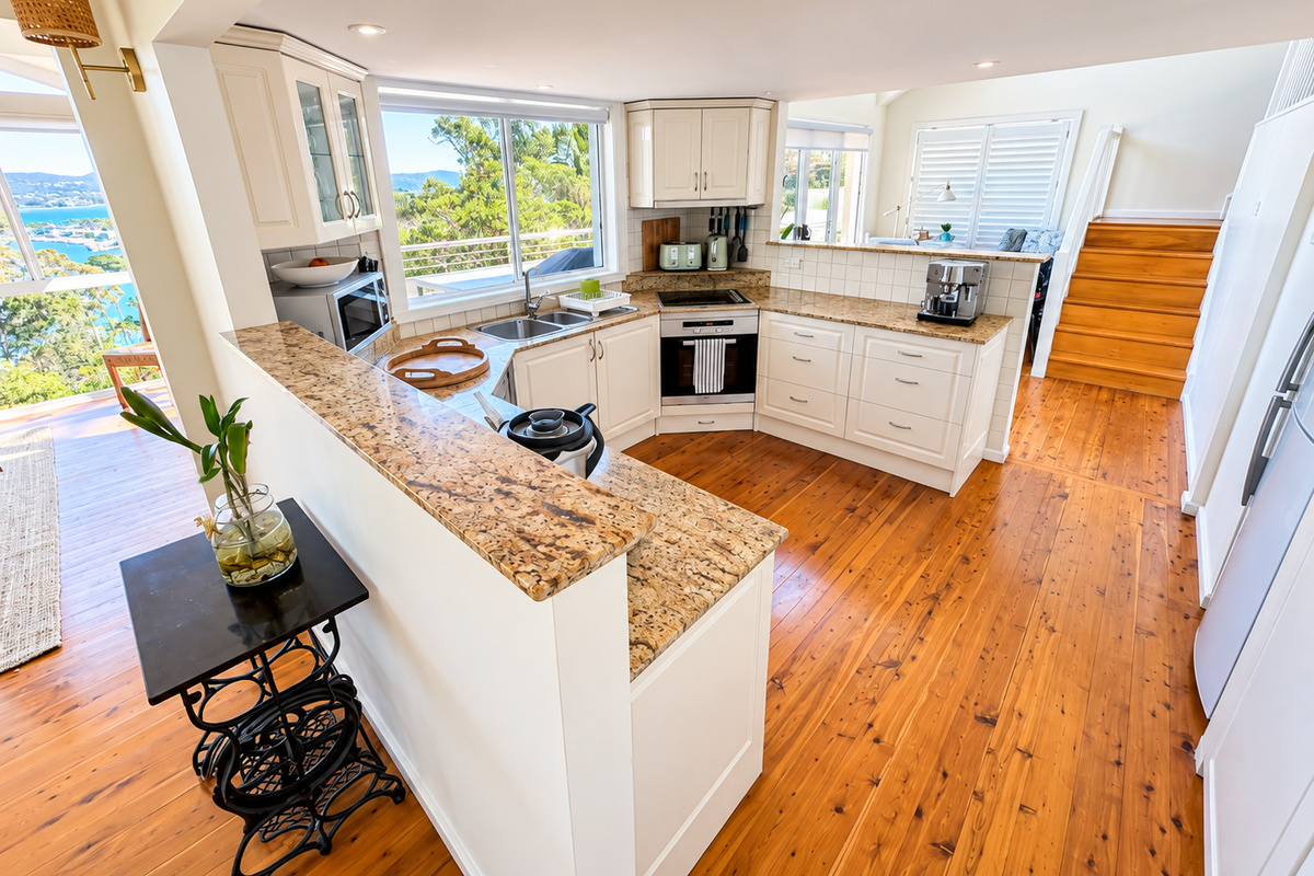 Designed for easy holiday living, the well-equipped kitchen offers plenty of room for preparing meals and entertaining. Its central position keeps you connected to the dining area, outdoor terrace and beautiful waterfront scenery.