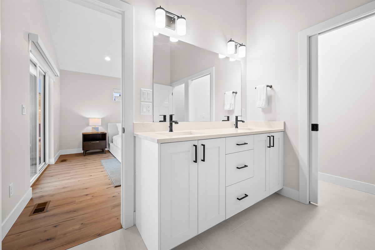 Spa-inspired Primary Ensuite with double vanity and sleek, modern finishes.