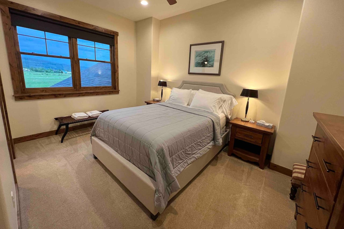 Upstairs queen bed in bedroom 3 with smart TV
