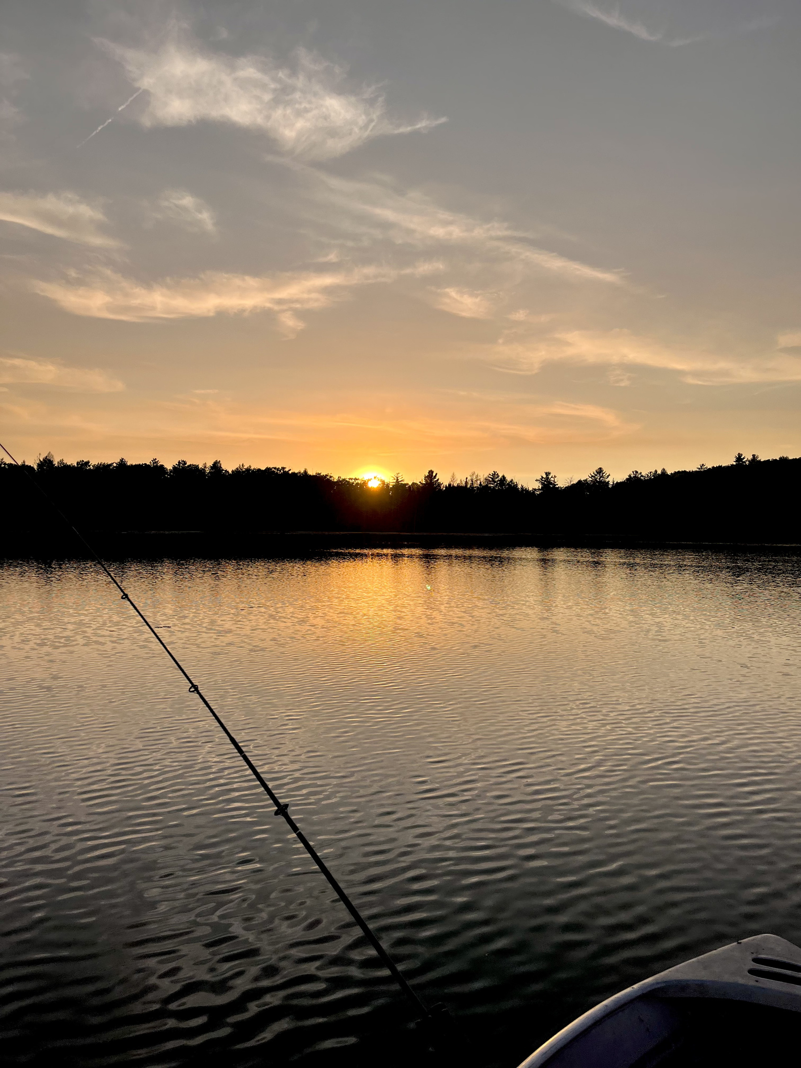 Fishing out on the boat at sunset.