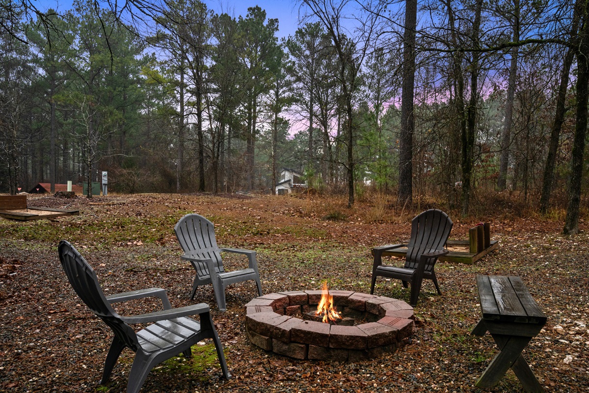 The fire pit area is ideal for gathering under the stars, roasting marshmallows, and sharing stories late into the evening.