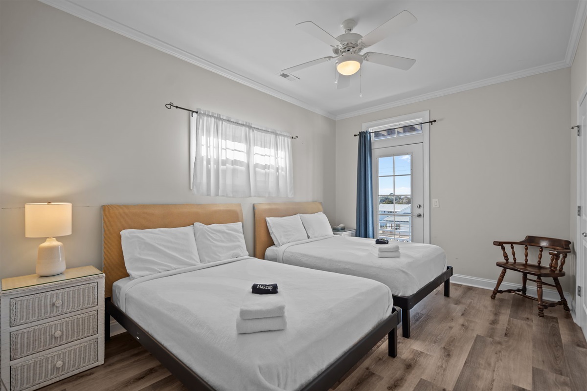 2nd floor bedroom #2 with 2 double beds, balcony access and intracoastal waterway views