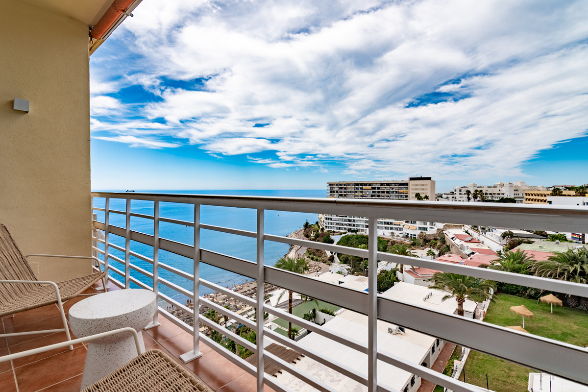 Balcony views over the pool, gardens, and surrounding area