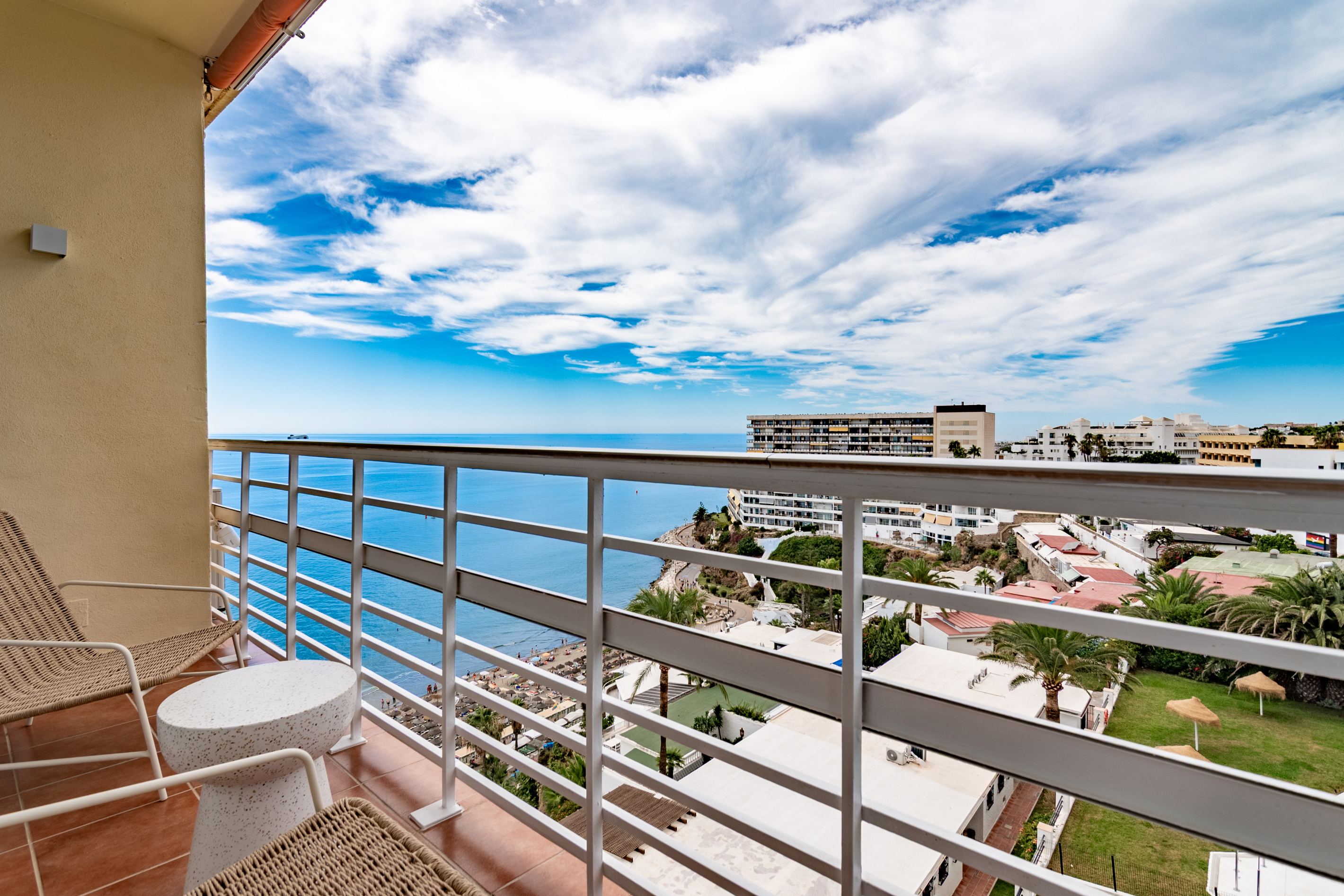 Balcony views over the pool, gardens, and surrounding area