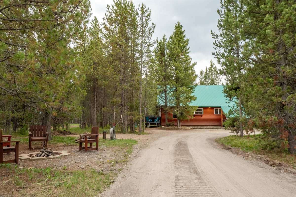 Fire pit and Circular drive to the front of the cabin
