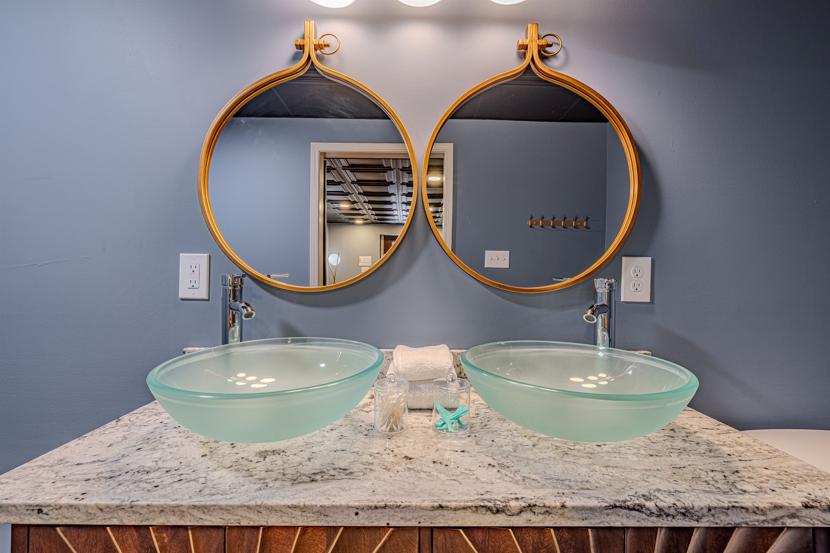 Maximize your morning routine with a dual vanity setup, featuring contemporary chrome faucets and plenty of space for two to get ready.
