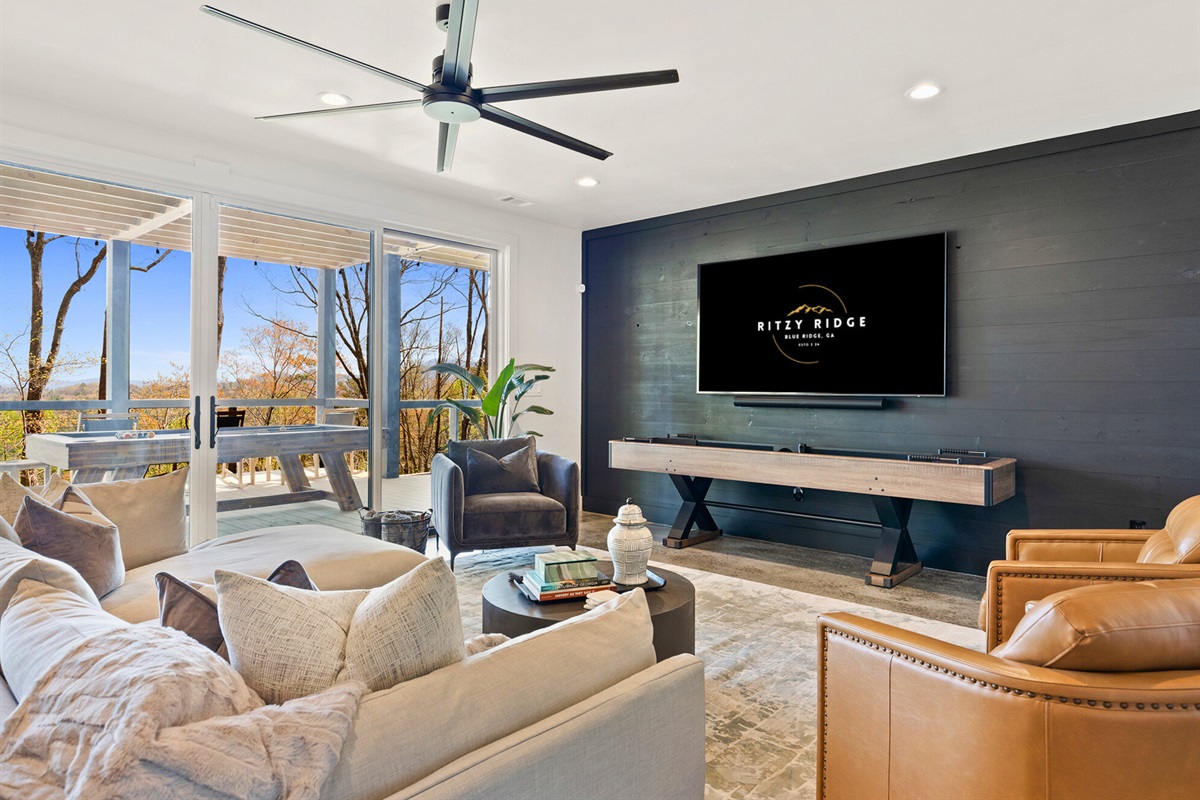 Chic comfort meets serene views in this lower living space that opens up to nature's masterpiece.